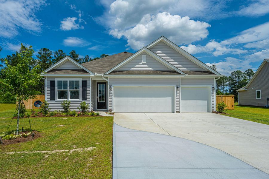 Front exterior of a new home in French Quarter Creek, Huger, SC, highlighting curb appeal (Image 21).