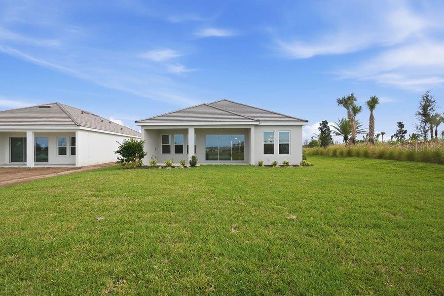 Exterior details and patio area of a home in Esplanade at Coasterra, Palmetto (Image 21).