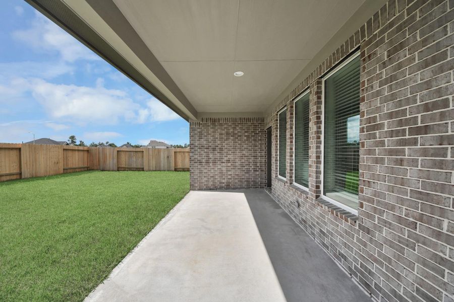 Experience outdoor living at its finest on this expansive covered patio, thoughtfully designed for BBQs and delightful outdoor dining Experience outdoor living at its finest on this expansive covered patio, thoughtfully designed for BBQs and delightful outdoor dining