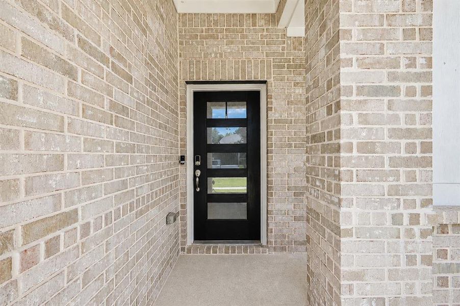 Exterior details and patio area of a home in Lakehaven - Premier Series, Farmersville (Image 3). Exterior details and patio area of a home in Lakehaven - Premier Series, Farmersville (Image 3).