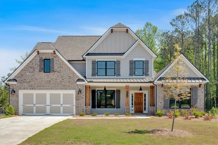 Front exterior of a new home in Springside Reserve, Powder Springs, GA, highlighting curb appeal (Image 2). Front exterior of a new home in Springside Reserve, Powder Springs, GA, highlighting curb appeal (Image 2).
