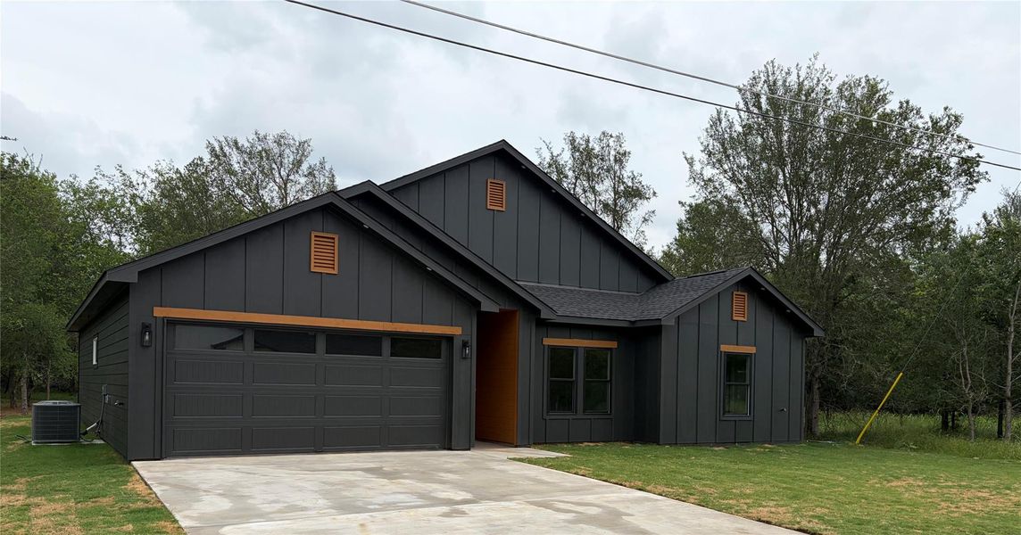 Contemporary dark gray exterior with board and batten siding
