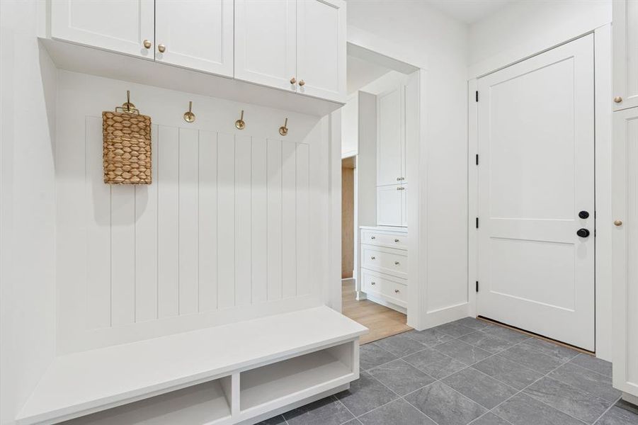 Door to the epoxied garage with full water filtration and softening system; more perfect hardware and details.