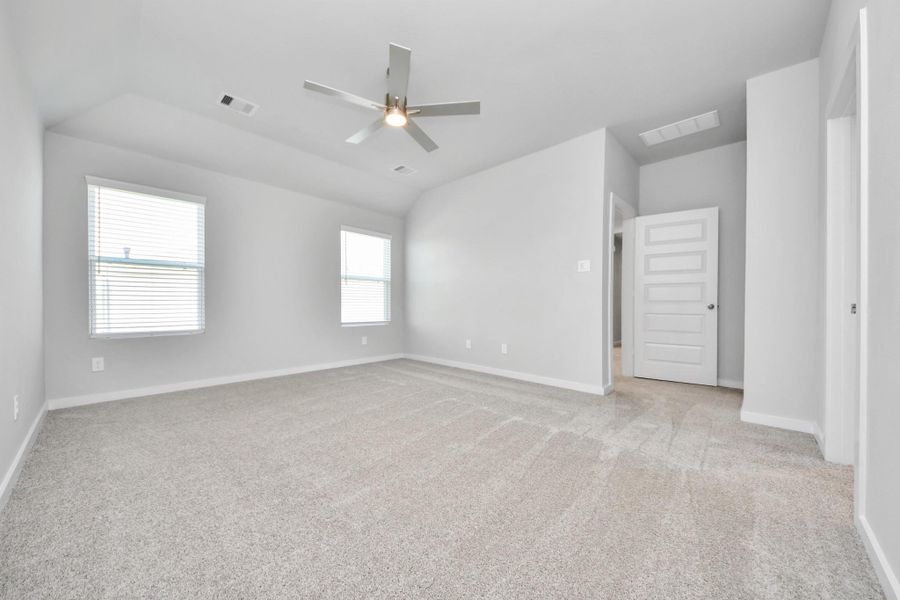 Another perspective unveils a comprehensive view of the serenity and comfort this primary suite offers. Sample photo of completed home with similar floor plan. Actual colors and selections may vary. Another perspective unveils a comprehensive view of the serenity and comfort this primary suite offers. Sample photo of completed home with similar floor plan. Actual colors and selections may vary.