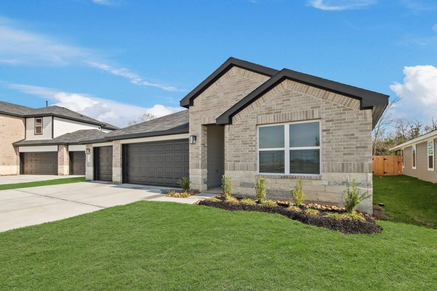 Front exterior of a new home in Medina, Dayton, TX, highlighting curb appeal (Image 16).