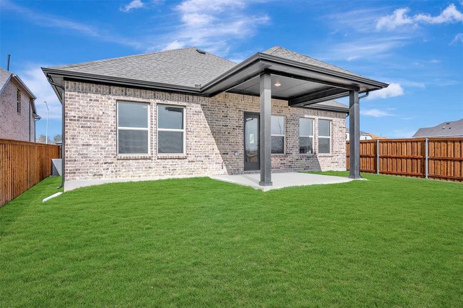 Exterior details and patio area of a home in Aspire at Reunion, Newark (Image 23).