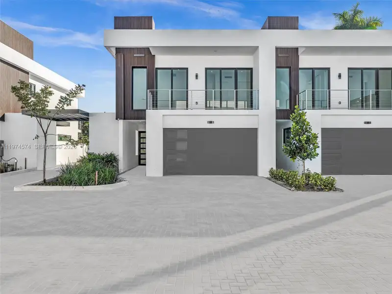Front exterior of a new home in , Dania Beach, FL, highlighting curb appeal (Image 30).