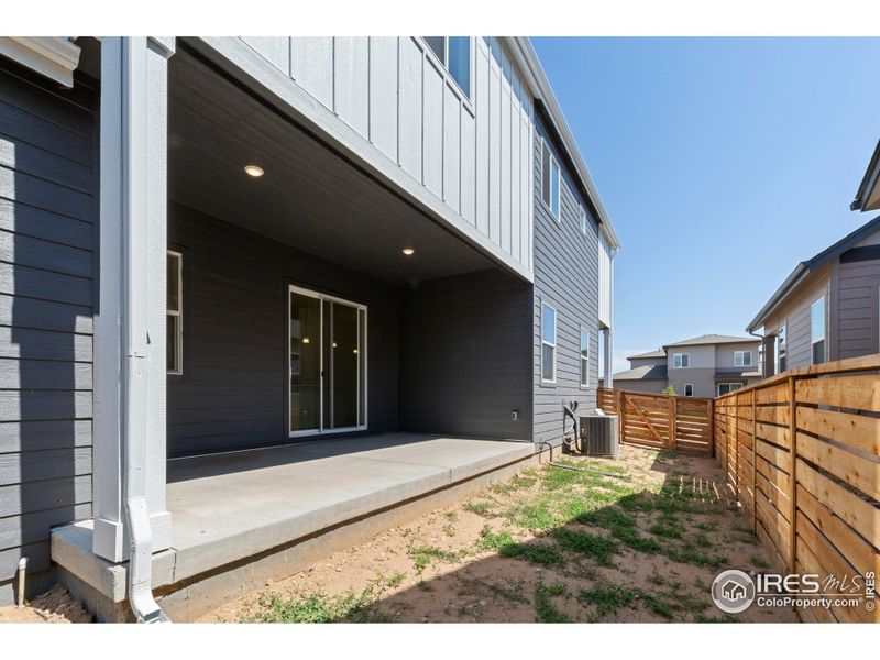 Front exterior of a new home in Trailside on Harmony, Timnath, CO, highlighting curb appeal (Image 14).