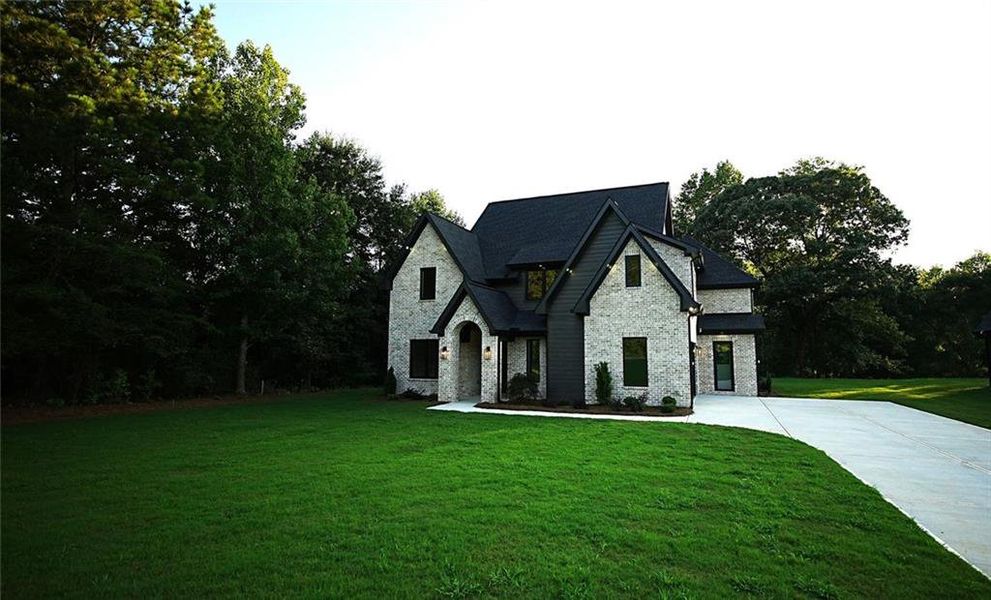 Front exterior of a new home in , Flowery Branch, GA, highlighting curb appeal (Image 28).