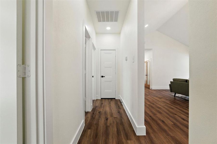 Corridor featuring dark wood-style floors and recessed lighting