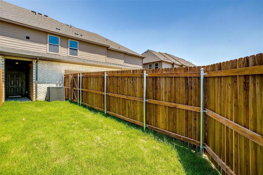 View of fenced backyard