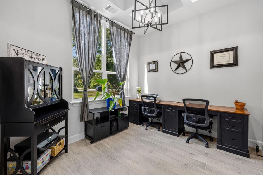 SECONDARY BEDROOM III / HOME OFFICE — Fourth bedroom is currently styled as a home office.