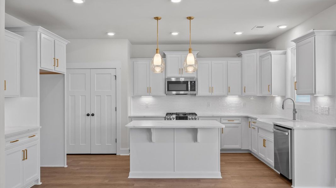 Highly functional kitchen offering a refined look and practical island at the center Highly functional kitchen offering a refined look and practical island at the center