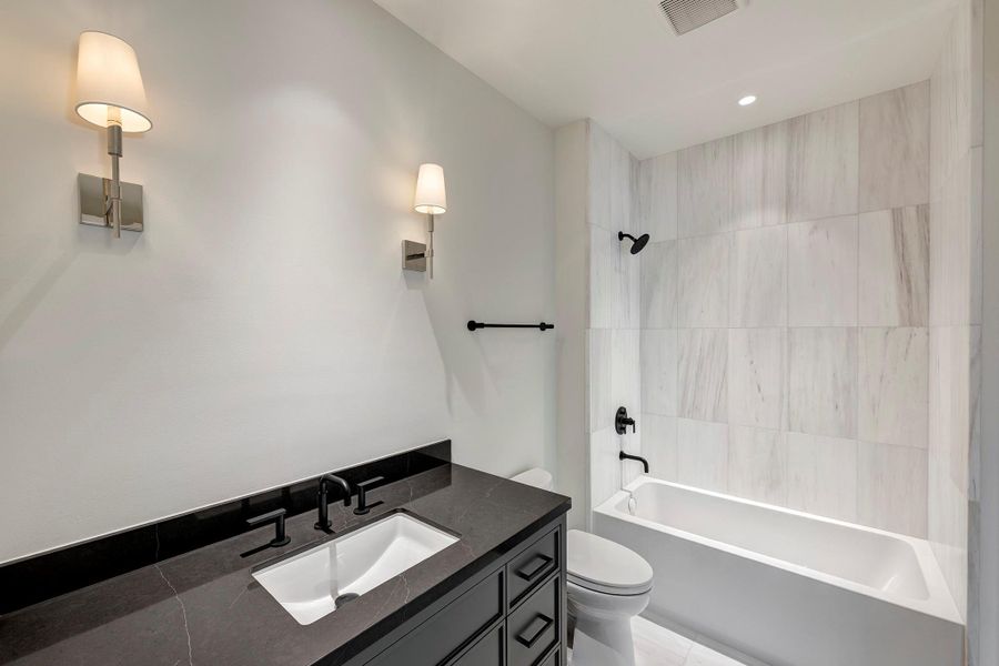 Ensuite bath to fourth bedroom with tub/shower.