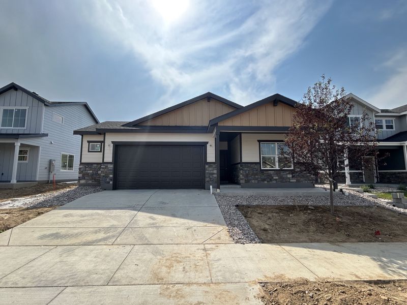 Front exterior of a new home in Union Colony West, Greeley, CO, highlighting curb appeal (Image 2). Front exterior of a new home in Union Colony West, Greeley, CO, highlighting curb appeal (Image 2).