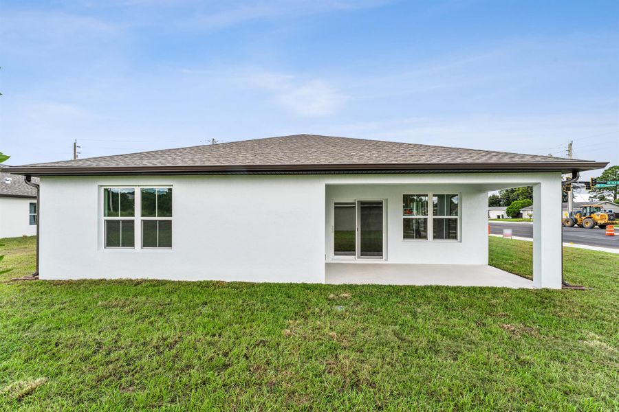 Front exterior of a new home in , Port St. Lucie, FL, highlighting curb appeal (Image 1).