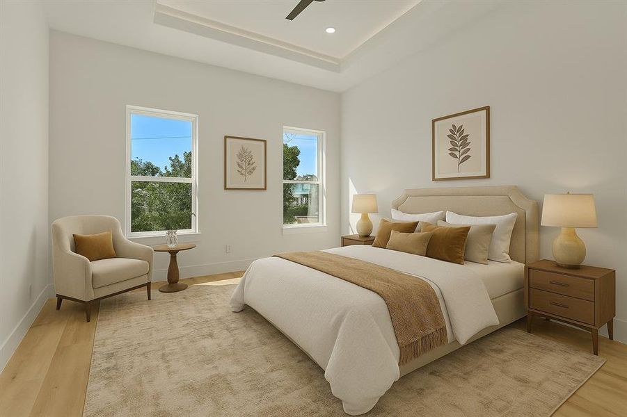 Digitally staged bedroom with light wood-style flooring, a tray ceiling, a ceiling fan, and recessed lighting