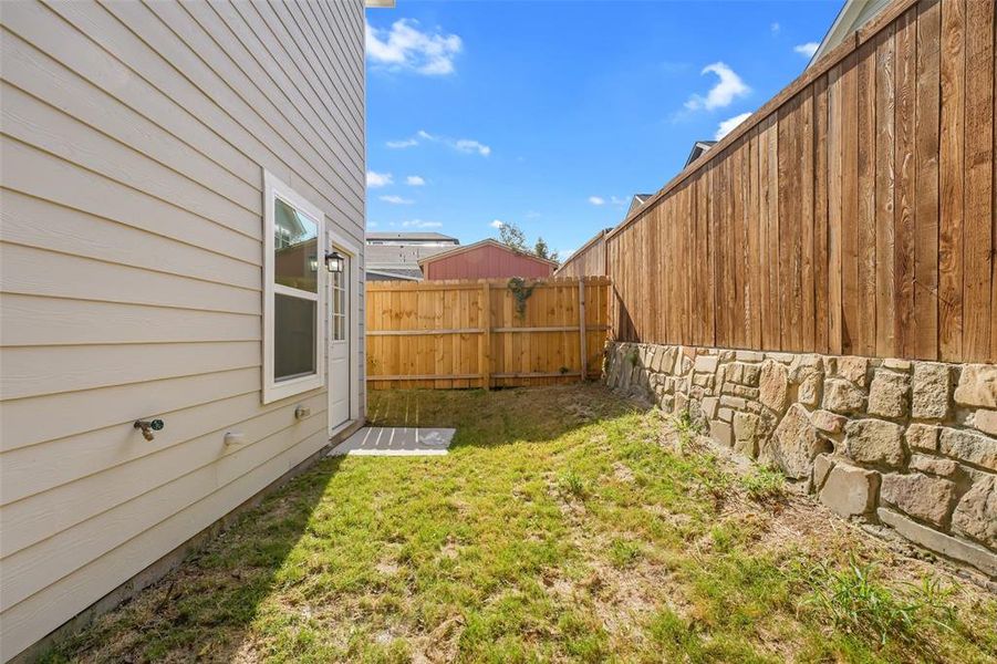 View of fenced backyard