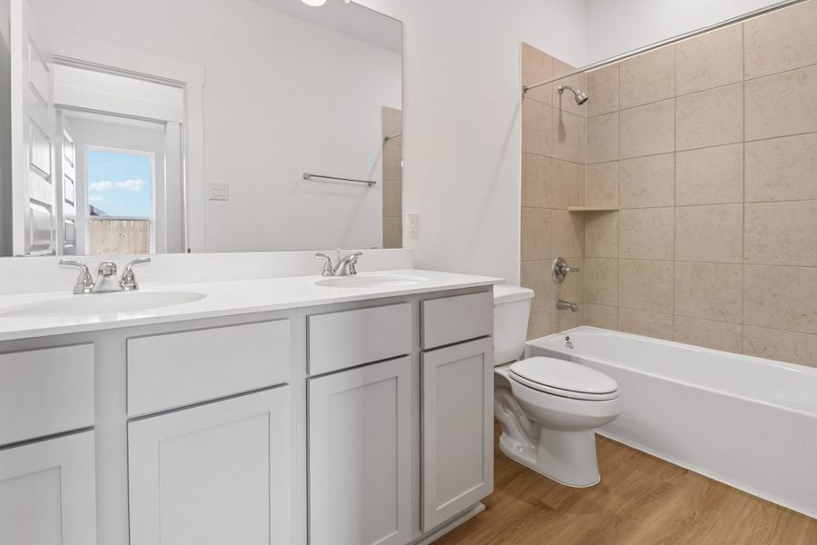 Furnished interior view inside a new home in Trinity Grove, Spring (Image 11).