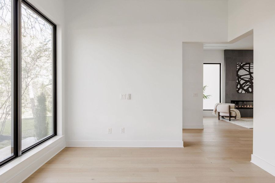 The office offers a quiet, light-filled workspace framed by expansive windows and natural views. The office offers a quiet, light-filled workspace framed by expansive windows and natural views.