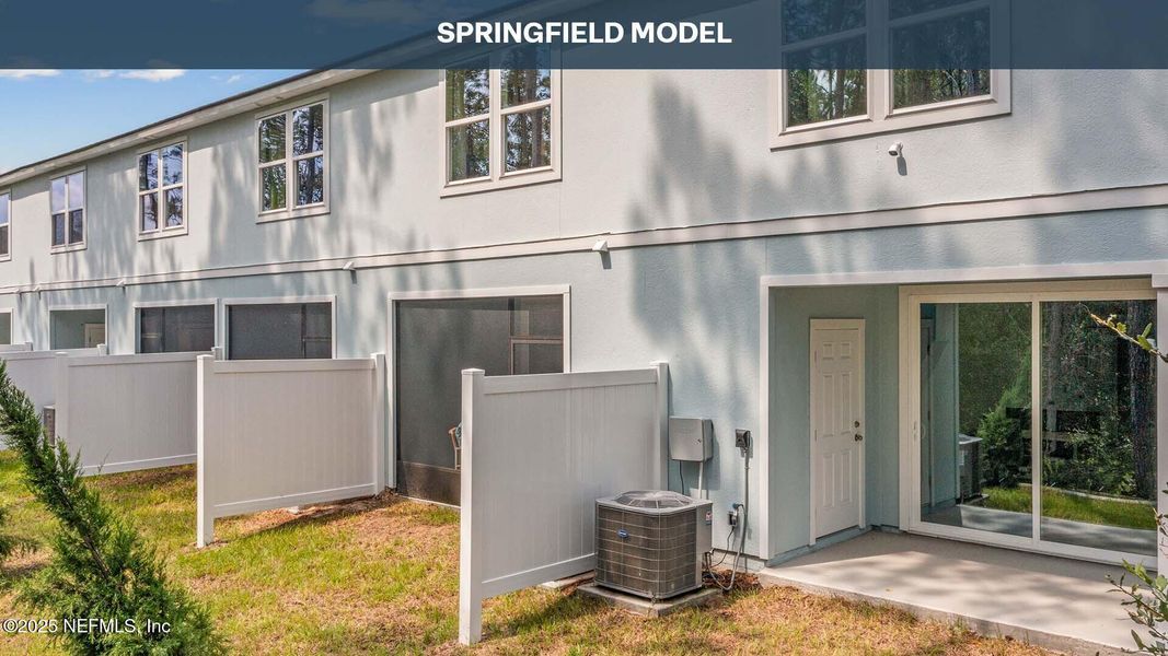 Exterior details and patio area of a home in Cordera Townhomes, St. Augustine (Image 24).