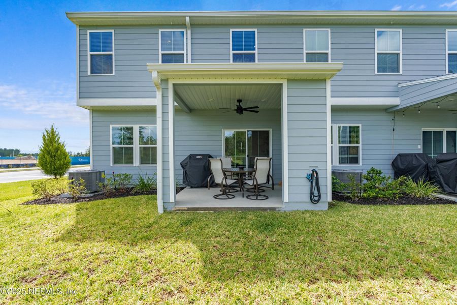 Exterior details and patio area of a home in Shearwater Townhomes, St. Augustine (Image 3).