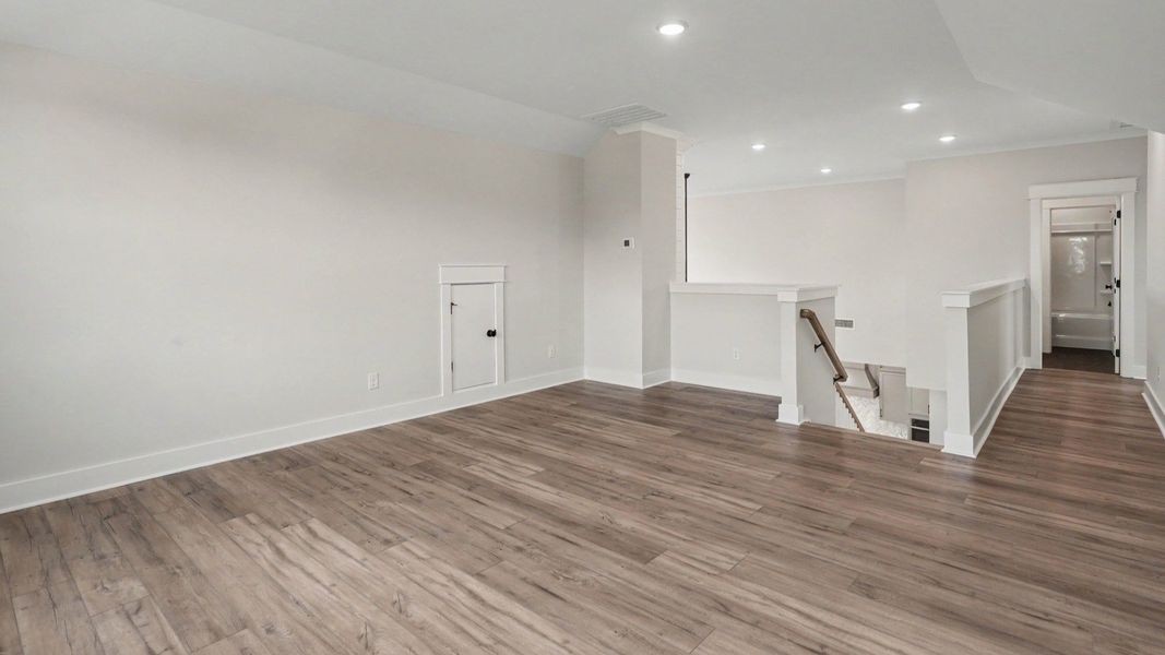 Loft area with hard surface flooring with access to bedrooms