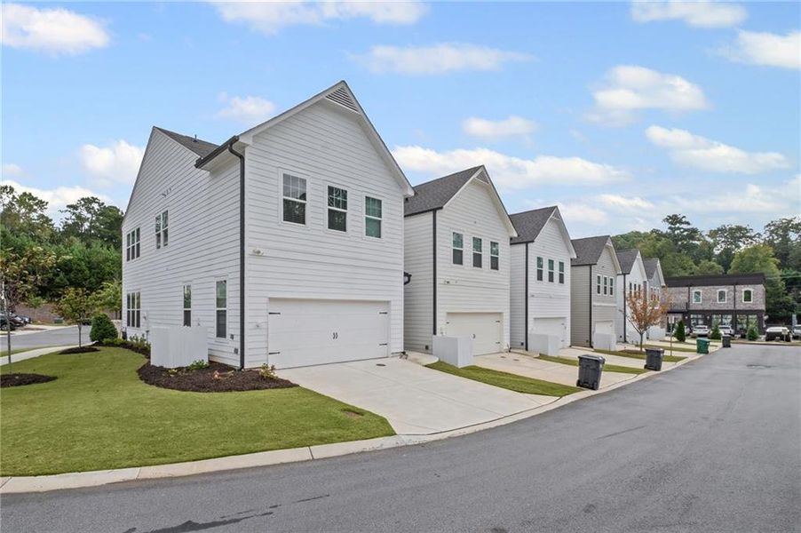 Front exterior of a new home in , Woodstock, GA, highlighting curb appeal (Image 25). Front exterior of a new home in , Woodstock, GA, highlighting curb appeal (Image 25).