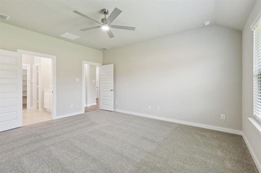 Primary Suite in the Heisman home plan by Trophy Signature Homes – REPRESENTATIVE PHOTO