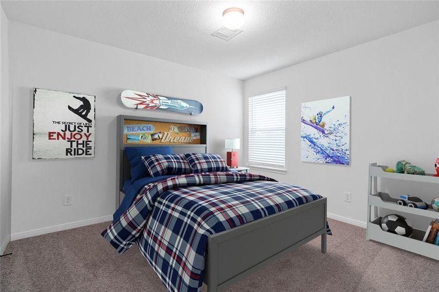 Secondary bedroom features plush carpet, neutral paint, lighting, window with privacy blinds and ample sized closet space.