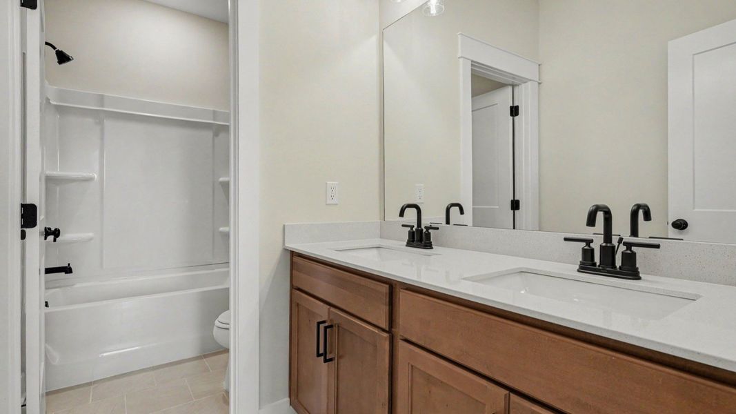 Secondary bathroom with dual vanity Secondary bathroom with dual vanity