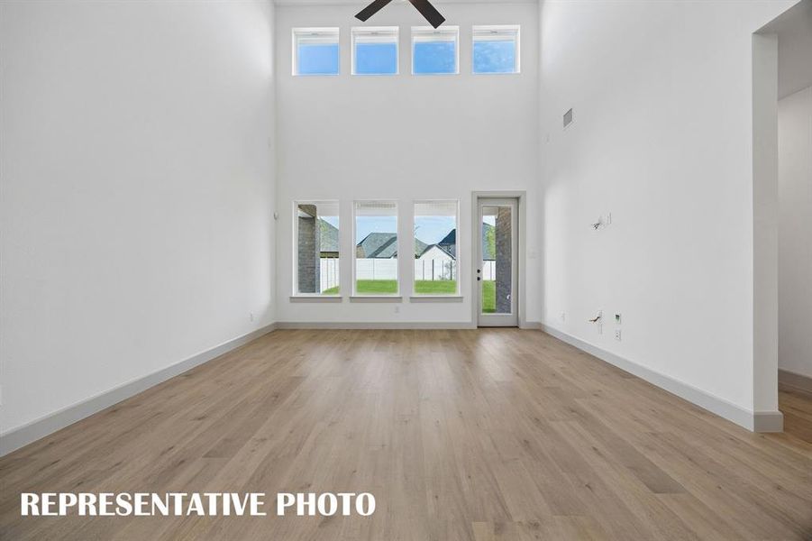 This light filled family room is large enough to host the entire family!  REPRESENTATIVE PHOTO