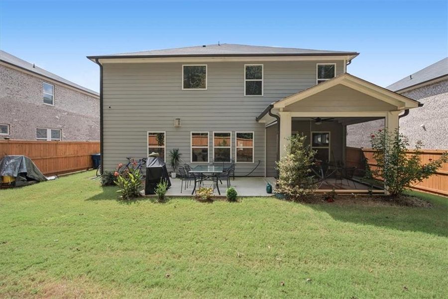 Exterior details and patio area of a home in Creekside at Oxford Park, Fairburn (Image 21).
