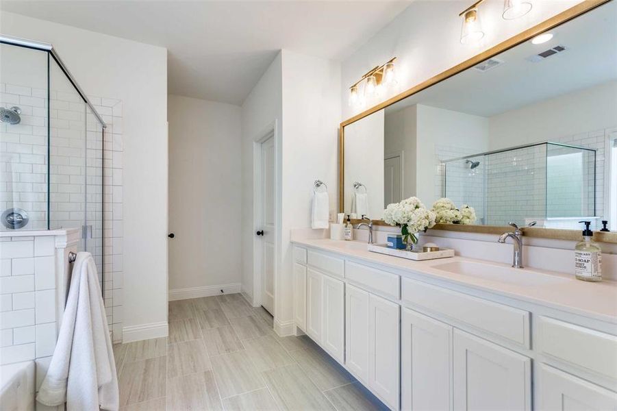 Bathroom with vanity and an enclosed shower