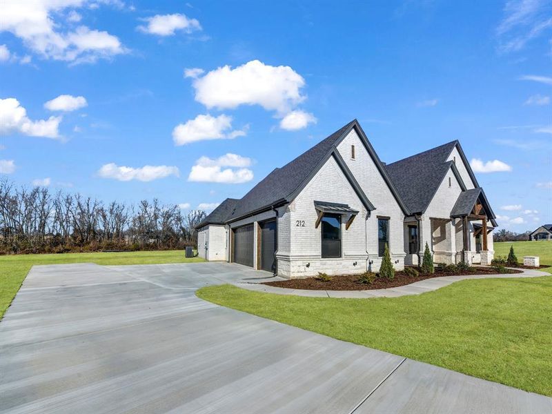 Front exterior of a new home in , Weatherford, TX, highlighting curb appeal (Image 27). Front exterior of a new home in , Weatherford, TX, highlighting curb appeal (Image 27).