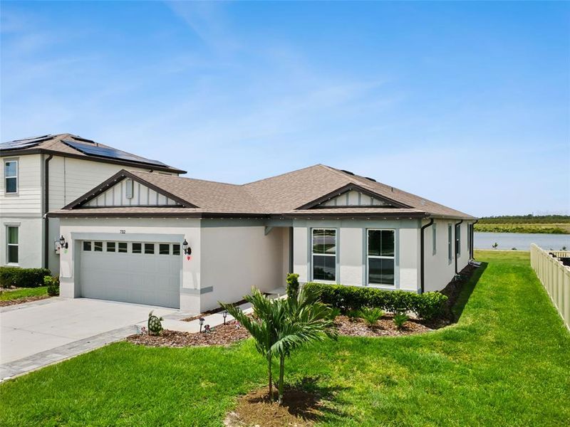 Front exterior of a new home in , Lake Alfred, FL, highlighting curb appeal (Image 24).