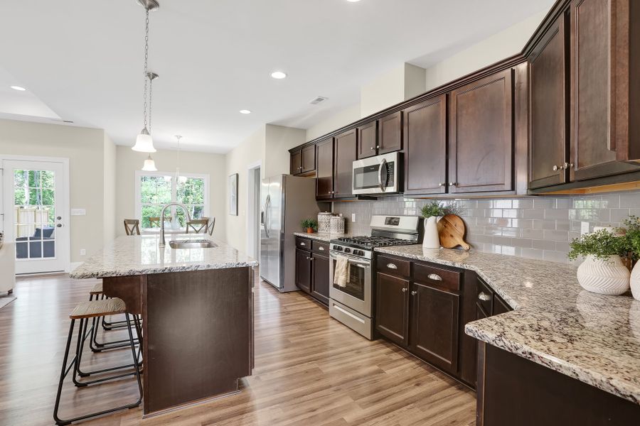 Representative furnished interior of a home built from the Sinclair by Bill Clark Homes in Osprey Landing, Southport (Image 11).