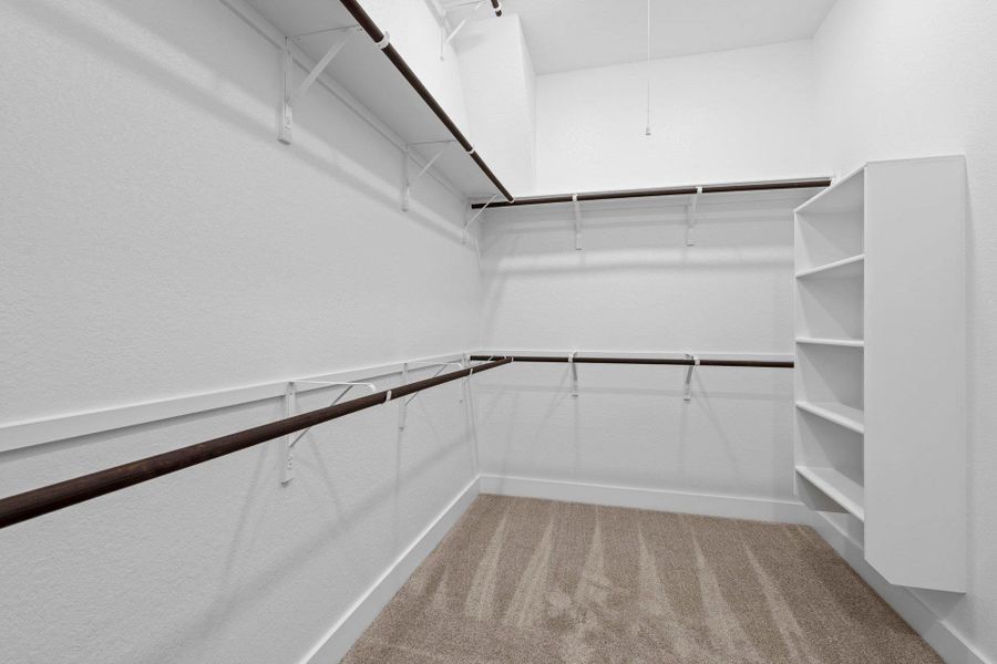 Walk-in closet in Primary Bedroom Walk-in closet in Primary Bedroom