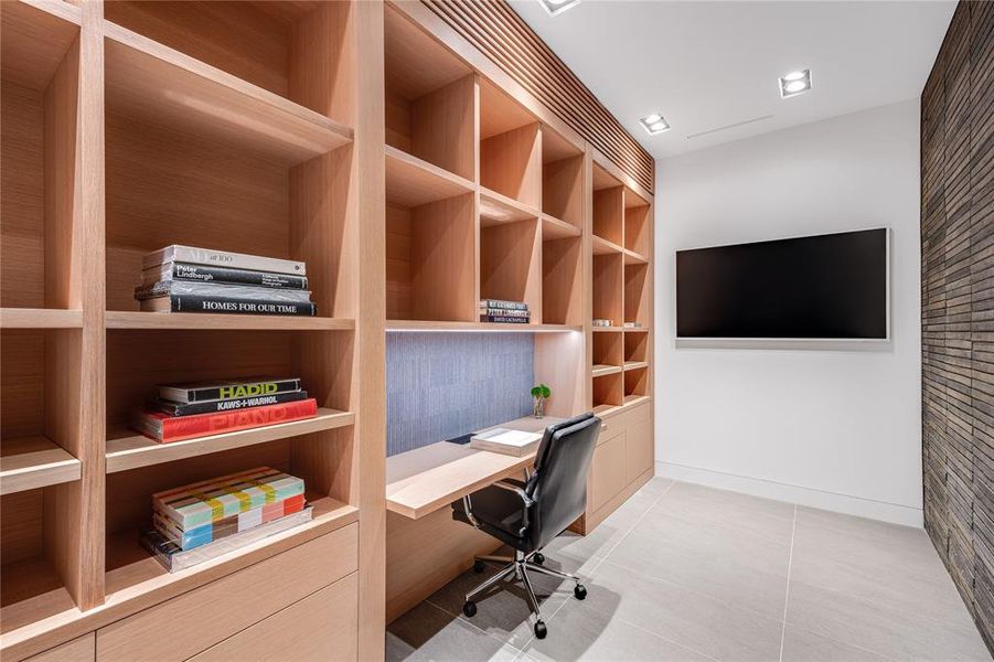 Office with custom built cabinetry.