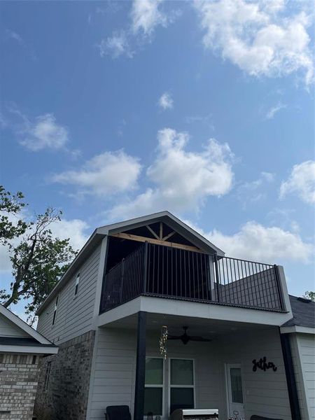 Backyard view of upstairs patio/deck/balcony