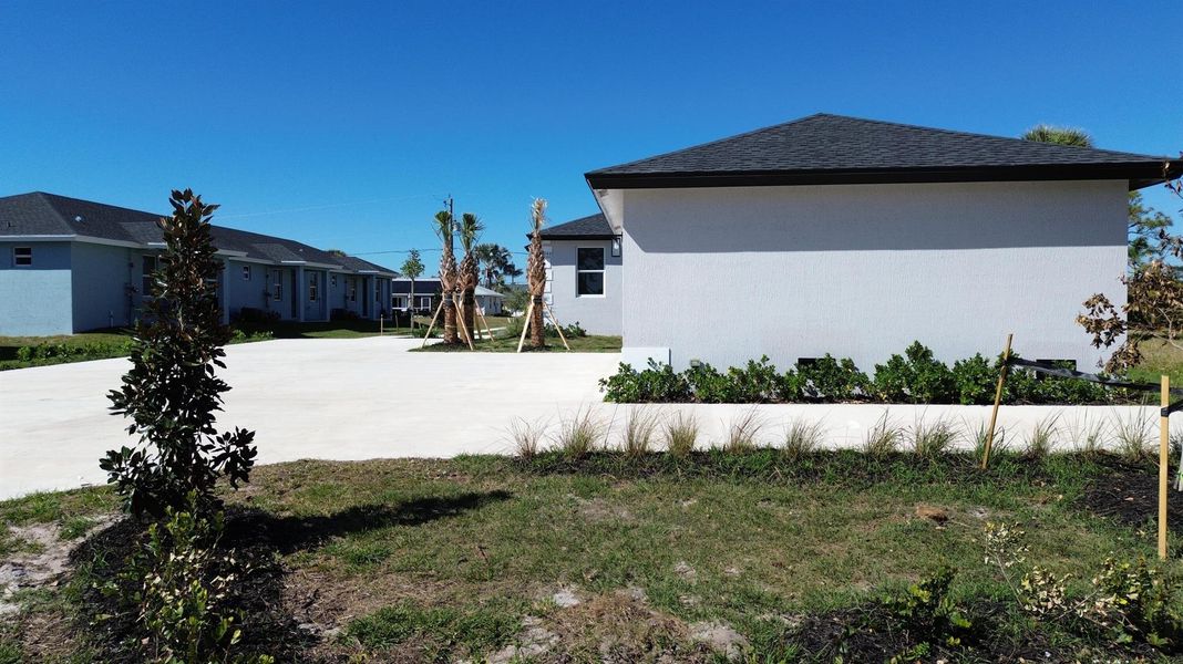 Front exterior of a new home in , Rotonda West, FL, highlighting curb appeal (Image 21).