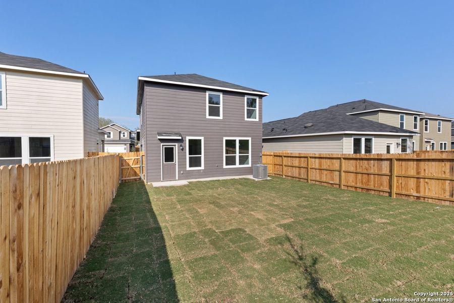 Exterior details and patio area of a home in Spanish Trails Villas, San Antonio (Image 3).