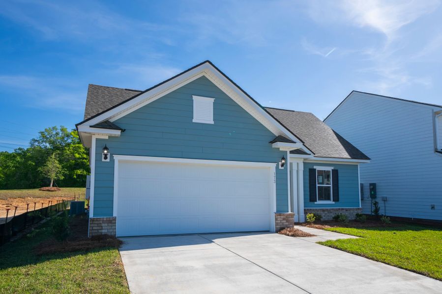 Front exterior of a new home in Monroe Preserve, Chapin, SC, highlighting curb appeal (Image 2). Front exterior of a new home in Monroe Preserve, Chapin, SC, highlighting curb appeal (Image 2).