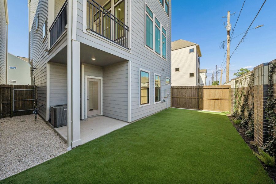 Exterior details and patio area of a home in Spring Valley Creek, Houston (Image 3).