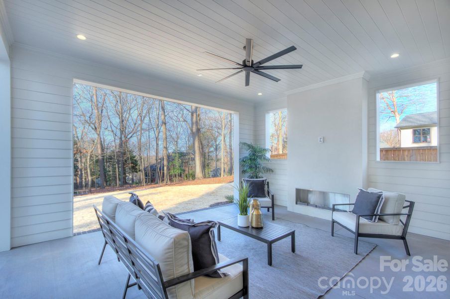 Covered porch with fireplace