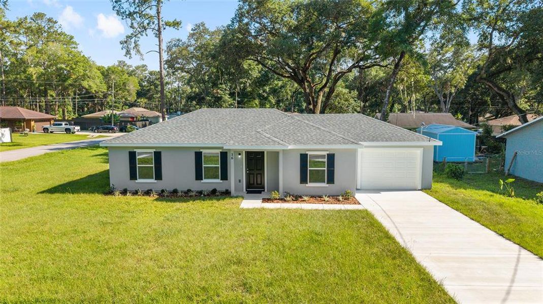 Front exterior of a new home in , Ocala, FL, highlighting curb appeal (Image 2).