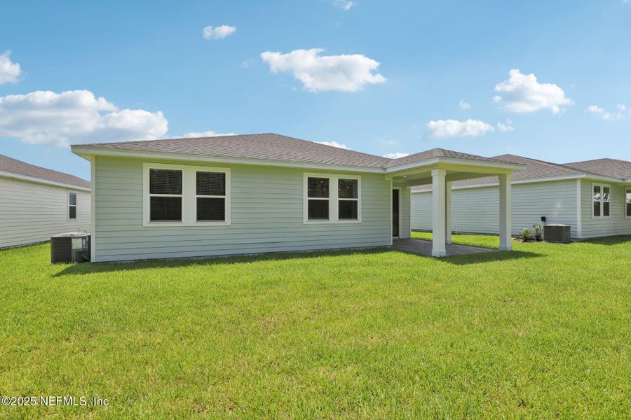 Front exterior of a new home in Colbert Landings, Palm Coast, FL, highlighting curb appeal (Image 17).