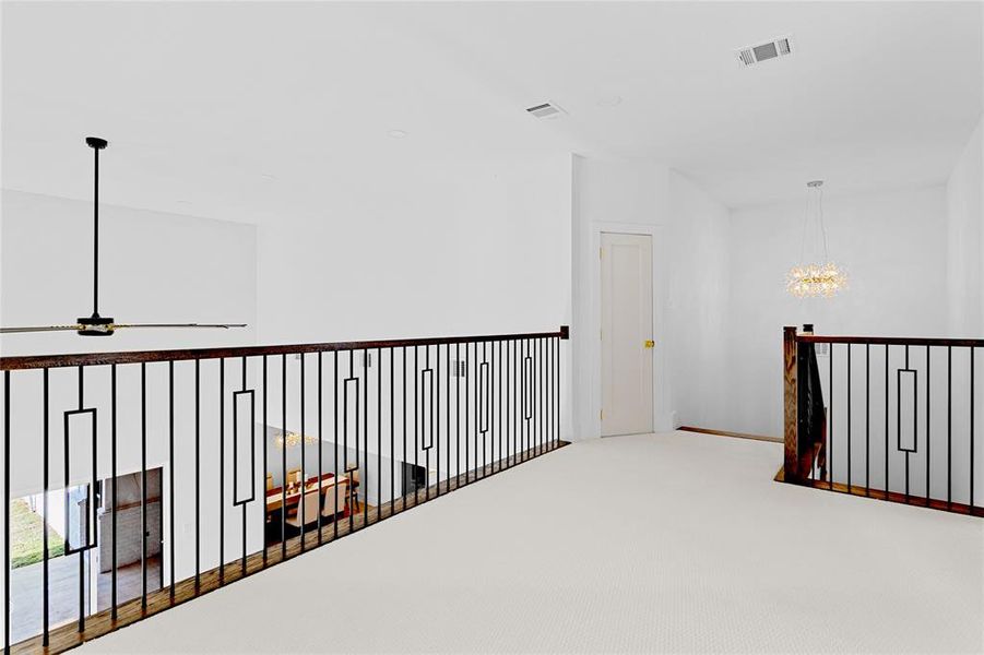 Family room on the 2nd Floor with a view to downstairs living and kitchen area. Carpet Flooring. Family room on the 2nd Floor with a view to downstairs living and kitchen area. Carpet Flooring.