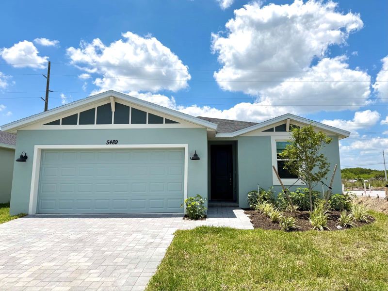 Front exterior of a new home in Hampton Park - Classic Series, Vero Beach, FL, highlighting curb appeal (Image 1). Front exterior of a new home in Hampton Park - Classic Series, Vero Beach, FL, highlighting curb appeal (Image 1).