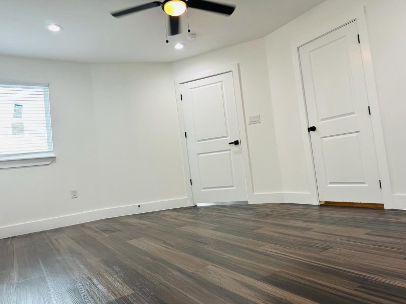 Empty room featuring dark wood finished floors, a ceiling fan, and recessed lighting Empty room featuring dark wood finished floors, a ceiling fan, and recessed lighting